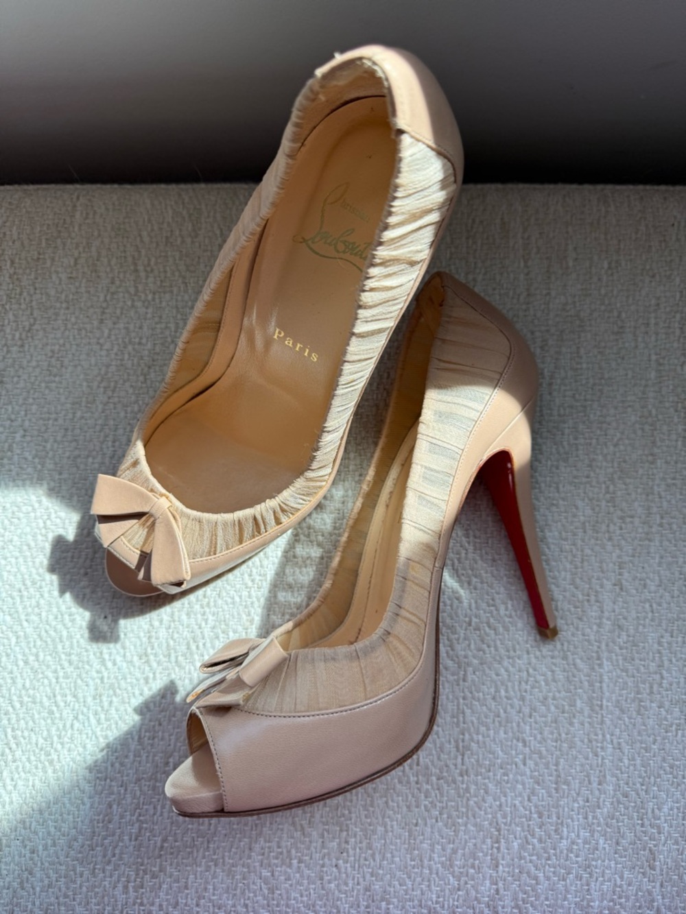 Christian Louboutin Beige Peep-Toe Pumps with Red Soles and Bow